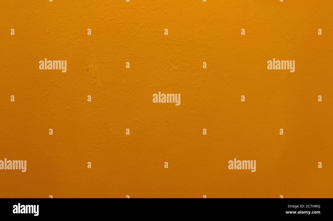Orange bemalter Wandhintergrund oder Textur Stockfoto