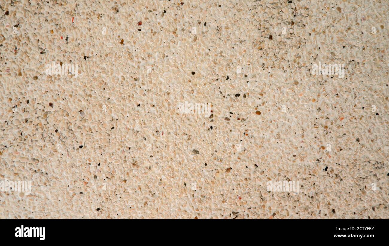 Kieselsteinwaschwand Oberfläche Textur Stockfoto