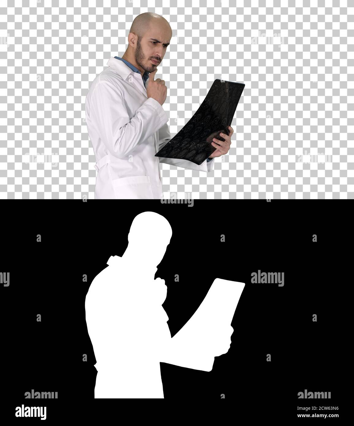 Junger männlicher Arzt, der einen MRT-Hirnscan liest und überprüft Wil Stockfoto