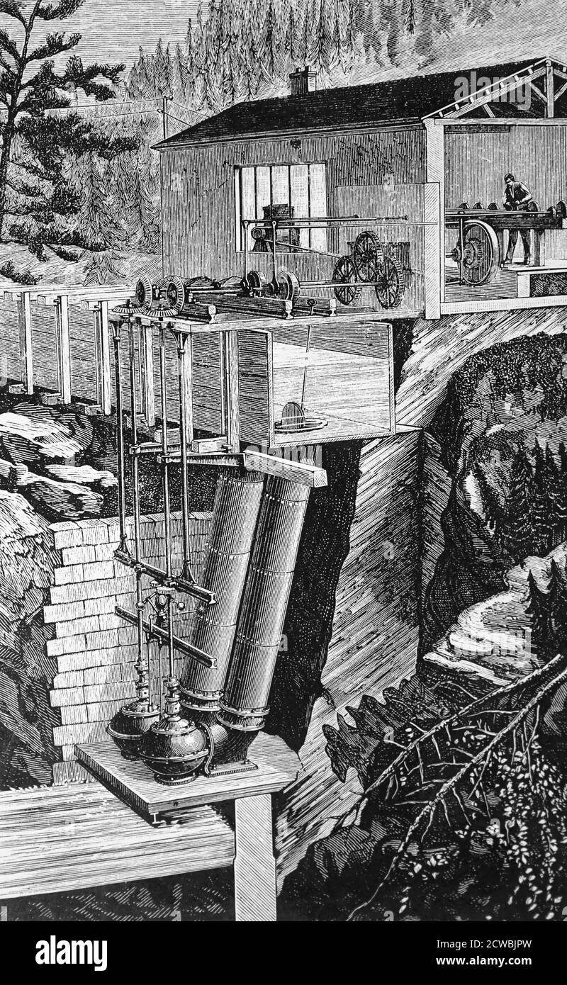 Gravur mit Turbinen auf der Portrush-Bahn. Dies war die erste Eisenbahn, die mit Wasserkraft betrieben wurde. Die Elektroarbeiten wurden unter der Leitung von Charles Siemens durchgeführt. Stockfoto