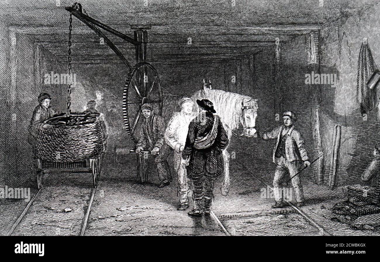 Gravur, die Arbeiter zeigt, die mit Kohle gefüllte Körbe (corves) mit einem Kran auf eine Straßenbahn laden. Stockfoto