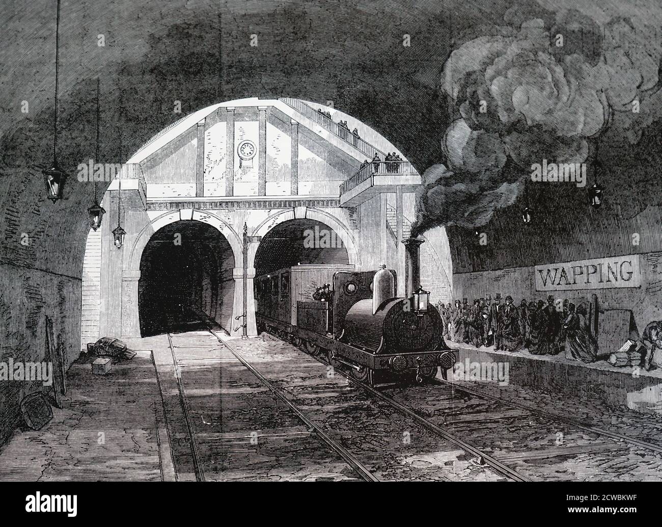 Gravur, die einen Zug zeigt, der bei Wapping aus dem Themse-Tunnel kommt. Marc Isambard Brunels Tunnel wurde zwischen 1825 und 1843 gebaut und wird immer noch von Elektrozügen zwischen Whitechapel und New Cross genutzt. Stockfoto