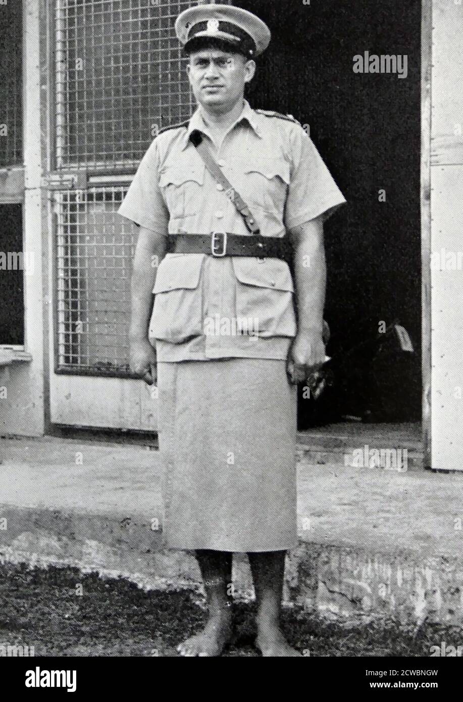 Tongan Polizist in Kilted Uniform. 1950 Stockfoto