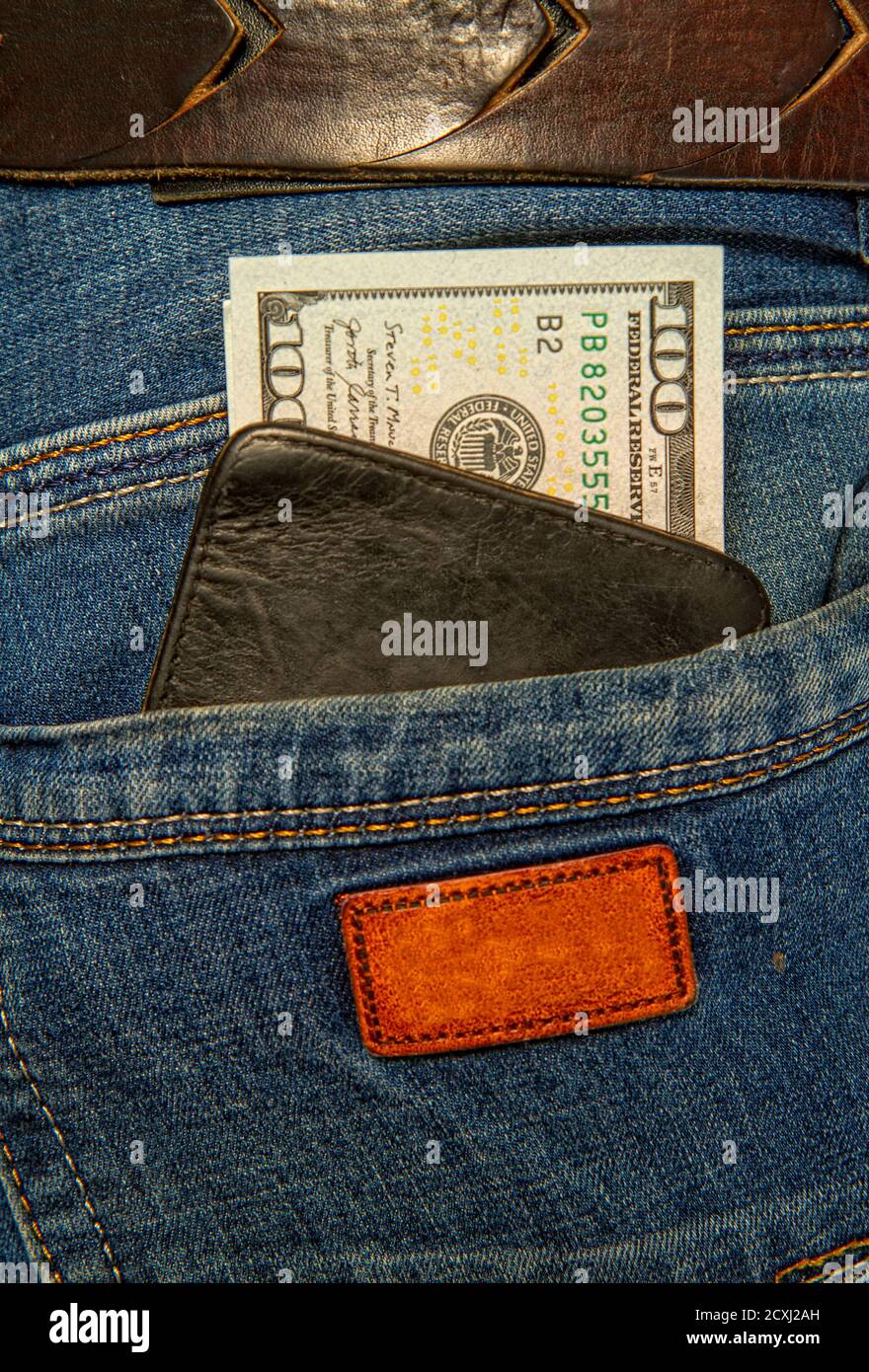 Jeans und Dollar Stockfoto