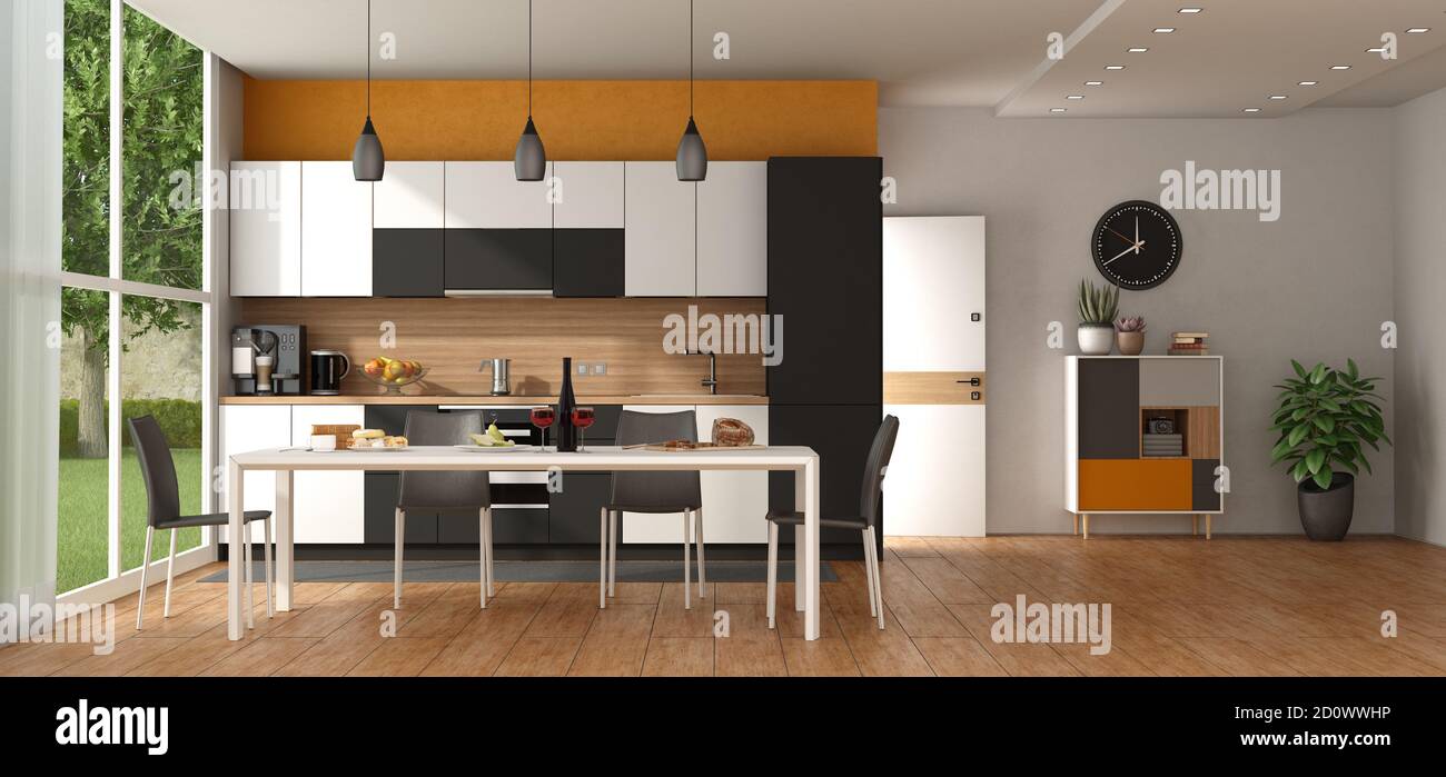 Moderne schwarz-weiße Küche gegen orange Wand, mit Esstisch, offene Tür und Sideboard auf Hintergrund - 3d-Rendering Stockfoto