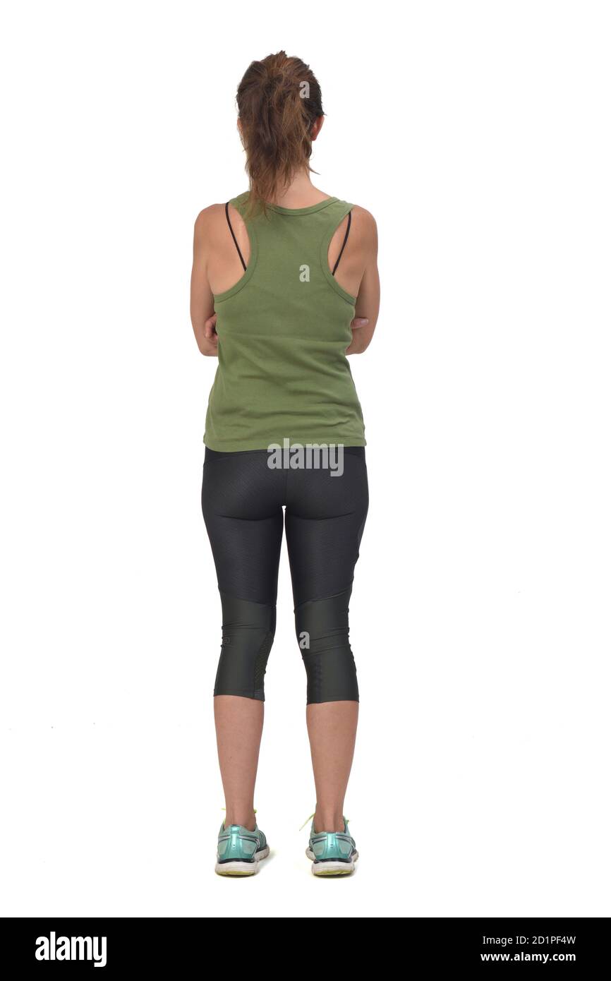 Rückansicht einer Frau mit Sportkleidung auf weißem Hintergrund, Arme gekreuzt Stockfoto