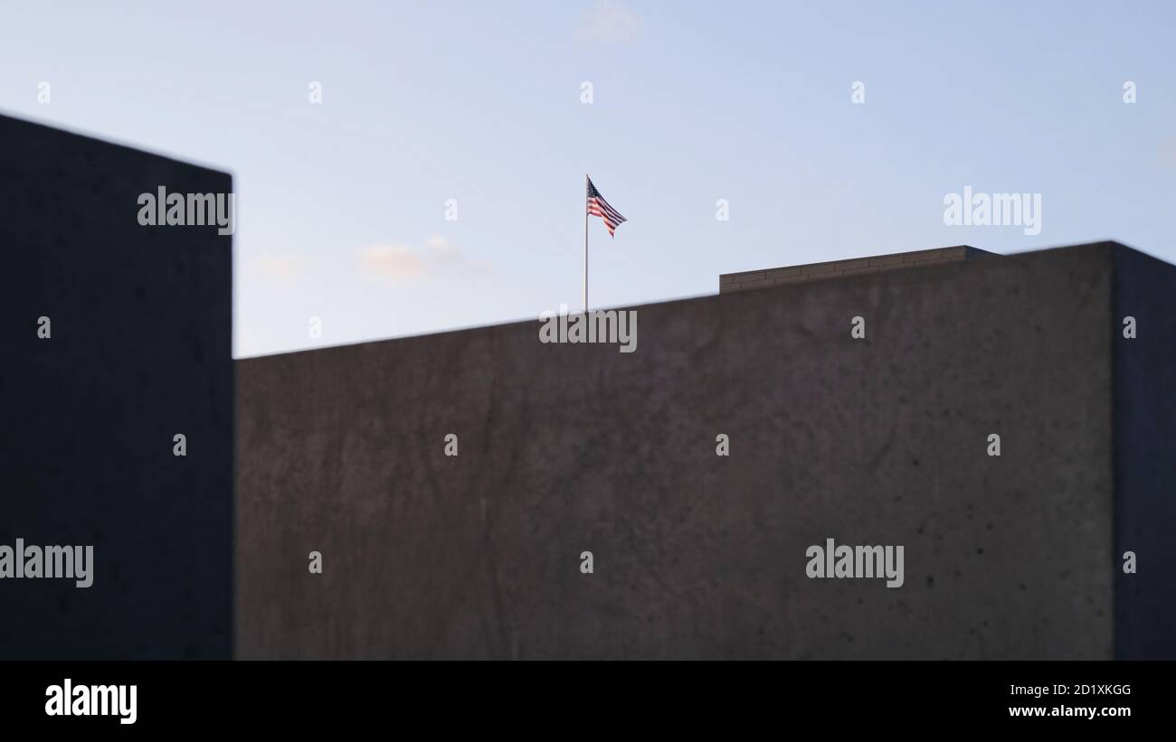 Die Vereinigten Staaten von Amerika Flagge in einer dramatischen Atmosphäre umgeben von Betonblöcken und grauen Himmel. Konzept für Amerika umgeben von Schwierigkeiten Stockfoto