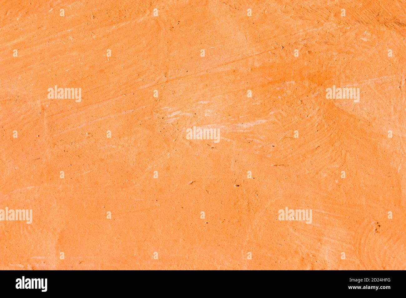 Orangefarbener strukturierter abstrakter Hintergrund auf Papier. Stockfoto