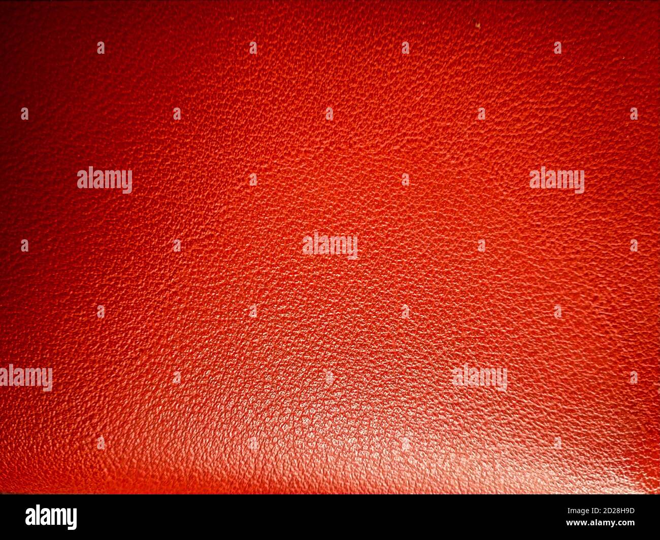 Rotes Leder, rosa Leder oder orange Leder Textur Hintergrund. Kuh Haut oder Schlange Haut für Leder verwendet. Stockfoto