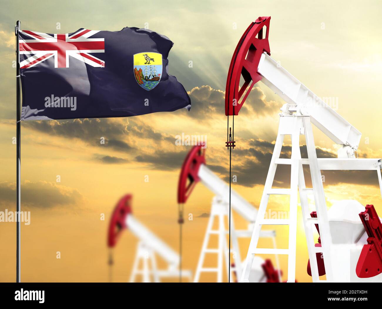 Ölbohrinseln vor dem Hintergrund des bunten Himmels und einer Fahnenstange mit der Flagge von St. Helena. Das Konzept der Ölproduktion, Mineralien, Entwicklung o Stockfoto