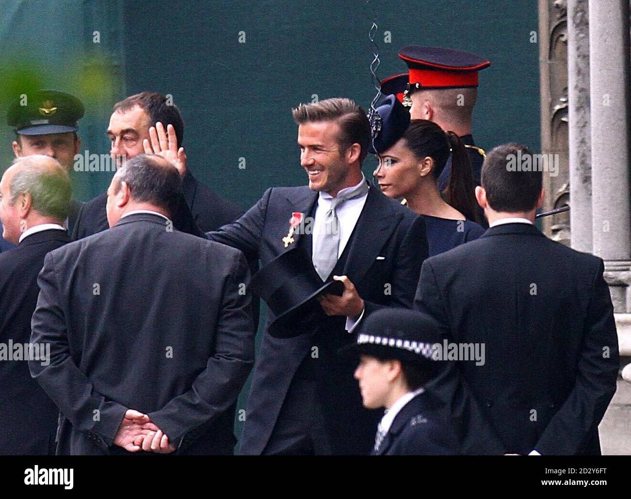 David und Victoria Beckham kommen vor der Hochzeit zwischen Prinz William und Kate Middleton in der Westminster Abbey an. Stockfoto