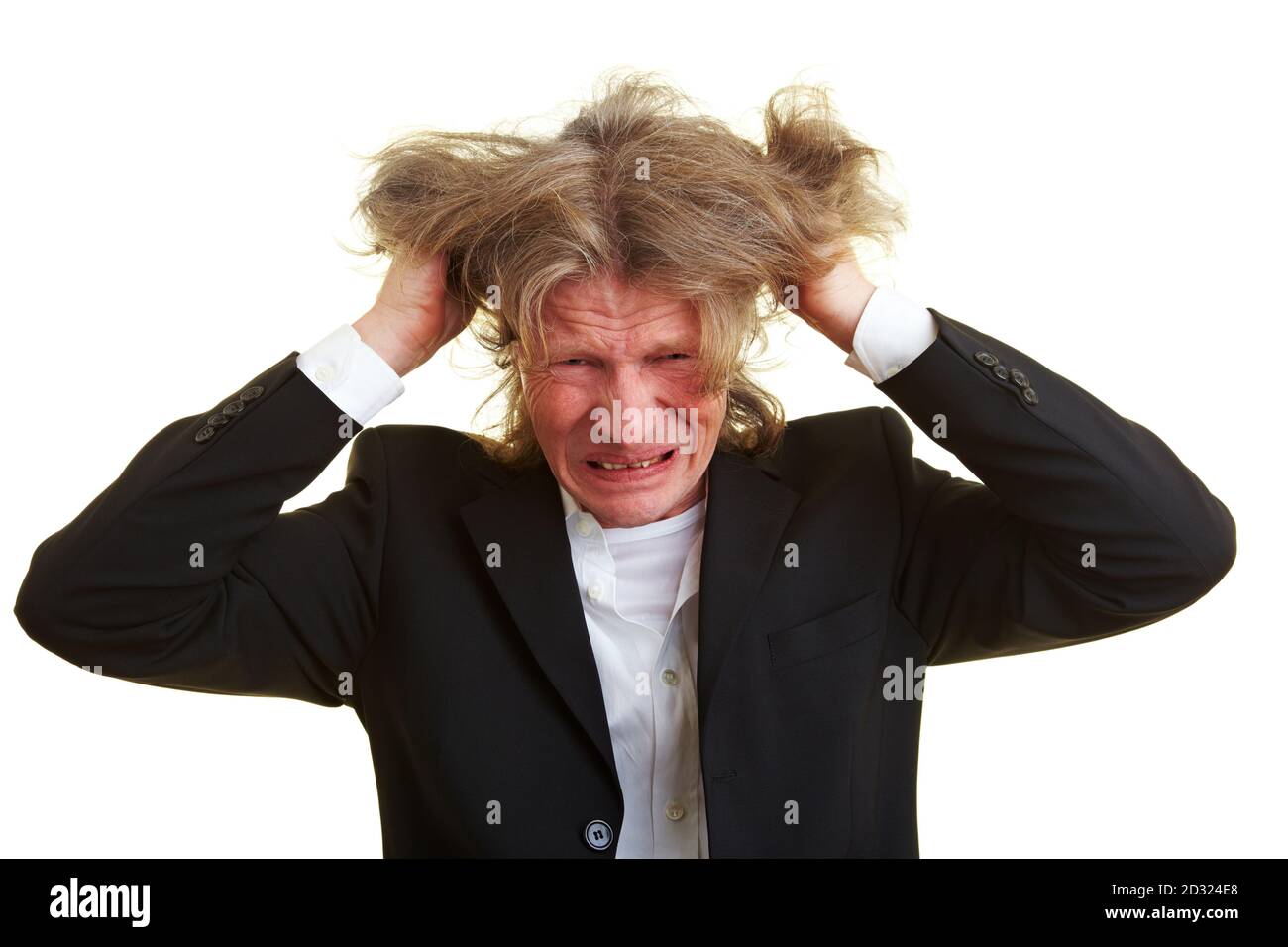Frustrierter Manager zieht seine grauen Haare Stockfoto