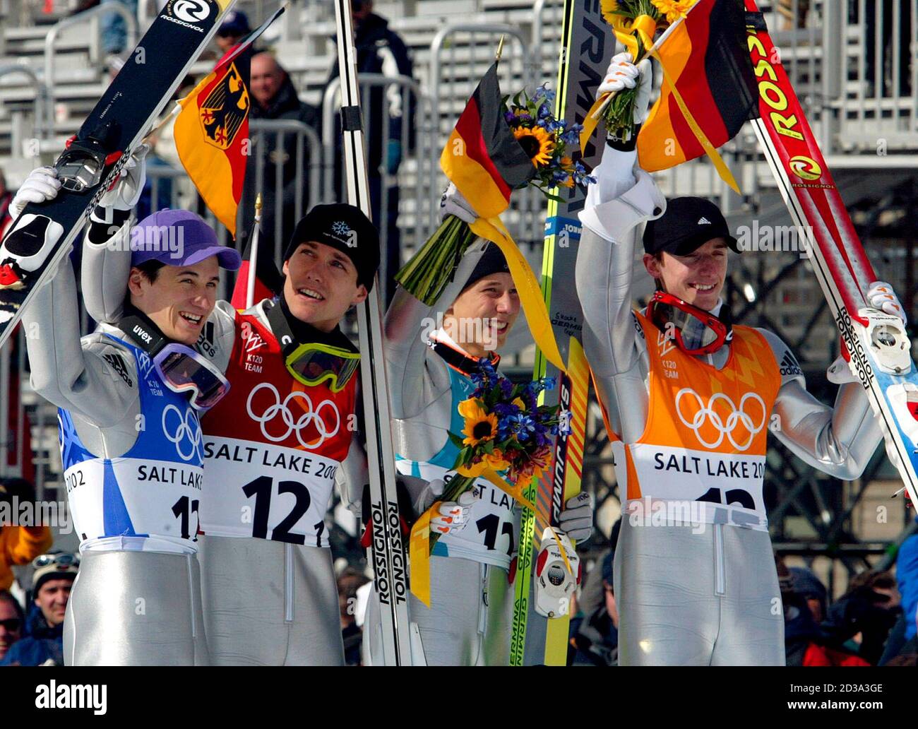 L-R) Martin Schmitt, Sven Hannawald, Stephan Hocke und Michael Uhrmann aus  Deutschland feiern den Sieg des Teams K120 bei den Olympischen  Winterspielen in Salt Lake 2002 am 18. Februar 2002. Deutschland gewann