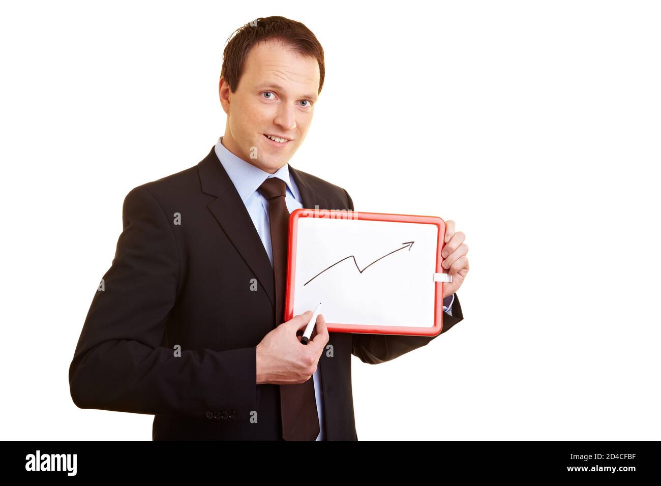 Glücklicher Geschäftsmann zeigt auf ein kleines Whiteboard Stockfoto