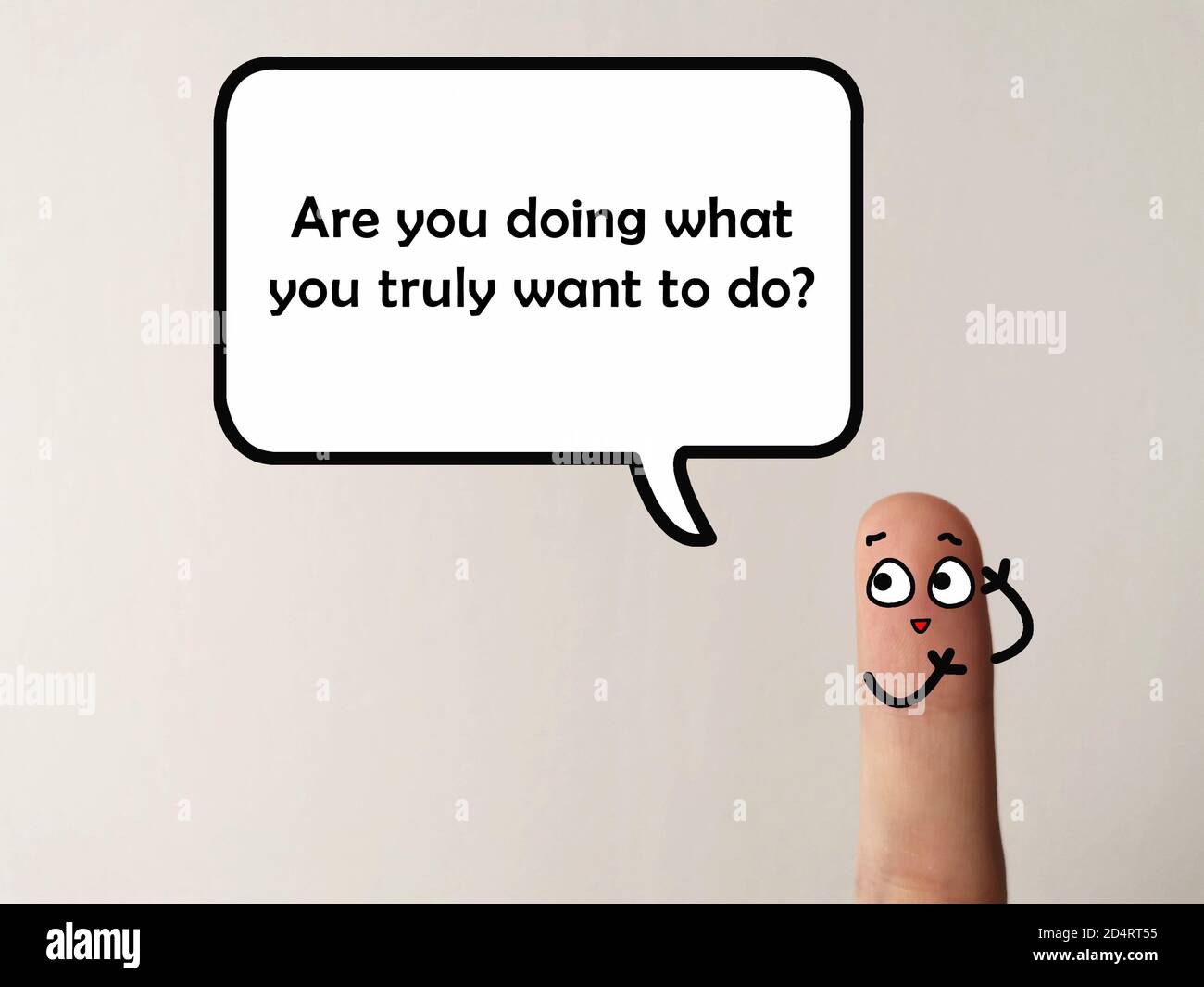 Ein Finger ist als Person dekoriert. Die Person fragt, ob wir das tun, was wir wirklich tun wollen. Es eignet sich für alles über Ambi verwendet werden Stockfoto