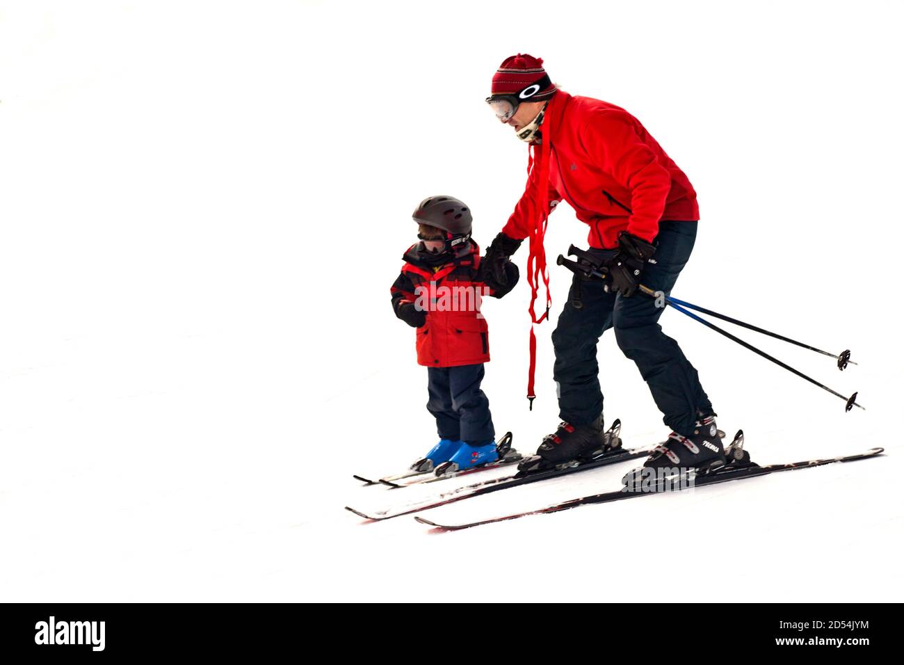 Kind lernt Skifahren auf Schnee Stockfoto