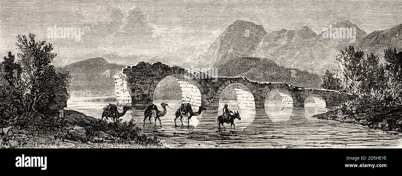 Kamele, die einen Fluss in der Nähe von Turgutlu am Fuße des Berges Sypilus, Türkei, forden. Altes XIX Jahrhundert gestochen von Le Tour du Monde 1864 Stockfoto