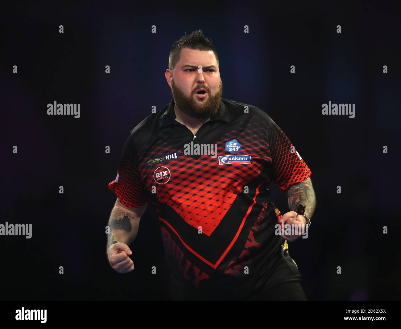 Michael Smith reagiert während des siebten Tages der William Hill World Darts Championships im Alexandra Palace, London Stockfoto