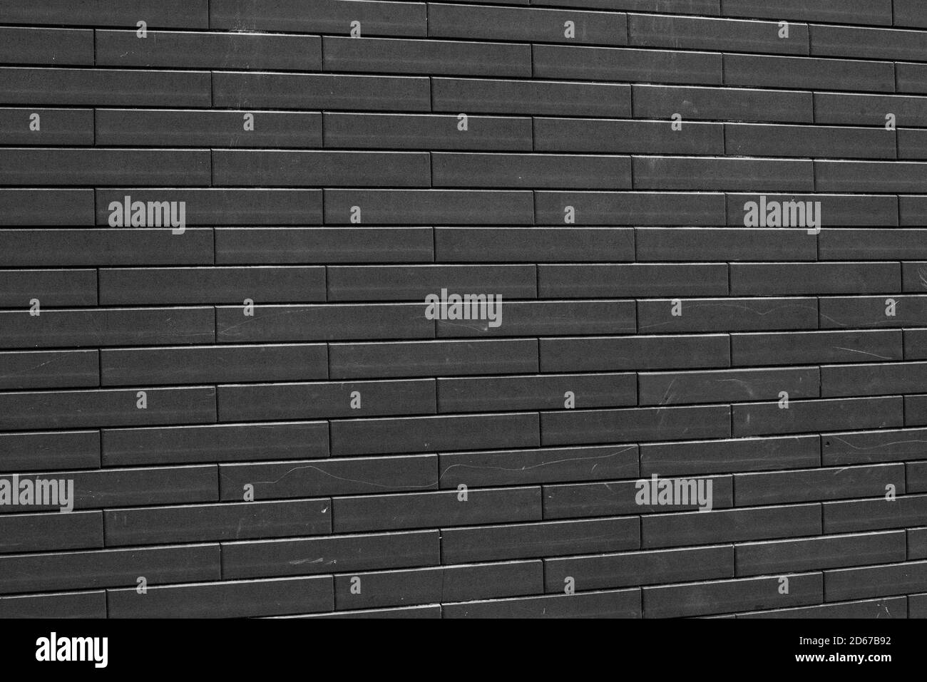 Schwarze Ziegelwand. Schwarze Ziegelwand Textur Mauerwerk Hintergrund Stockfoto