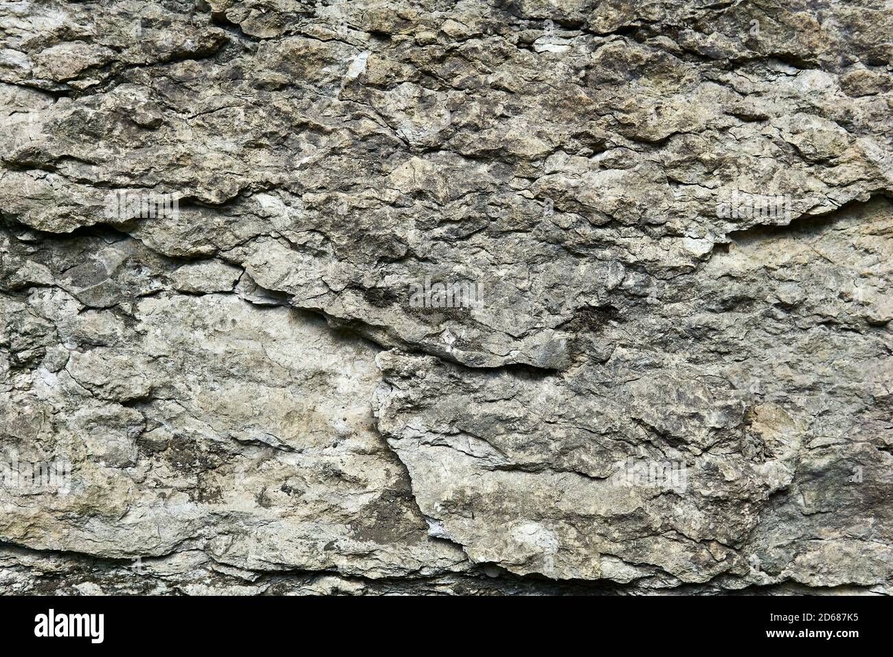 Hintergrund, Textur - Oberfläche von grobem grauen Kalkstein Stockfoto