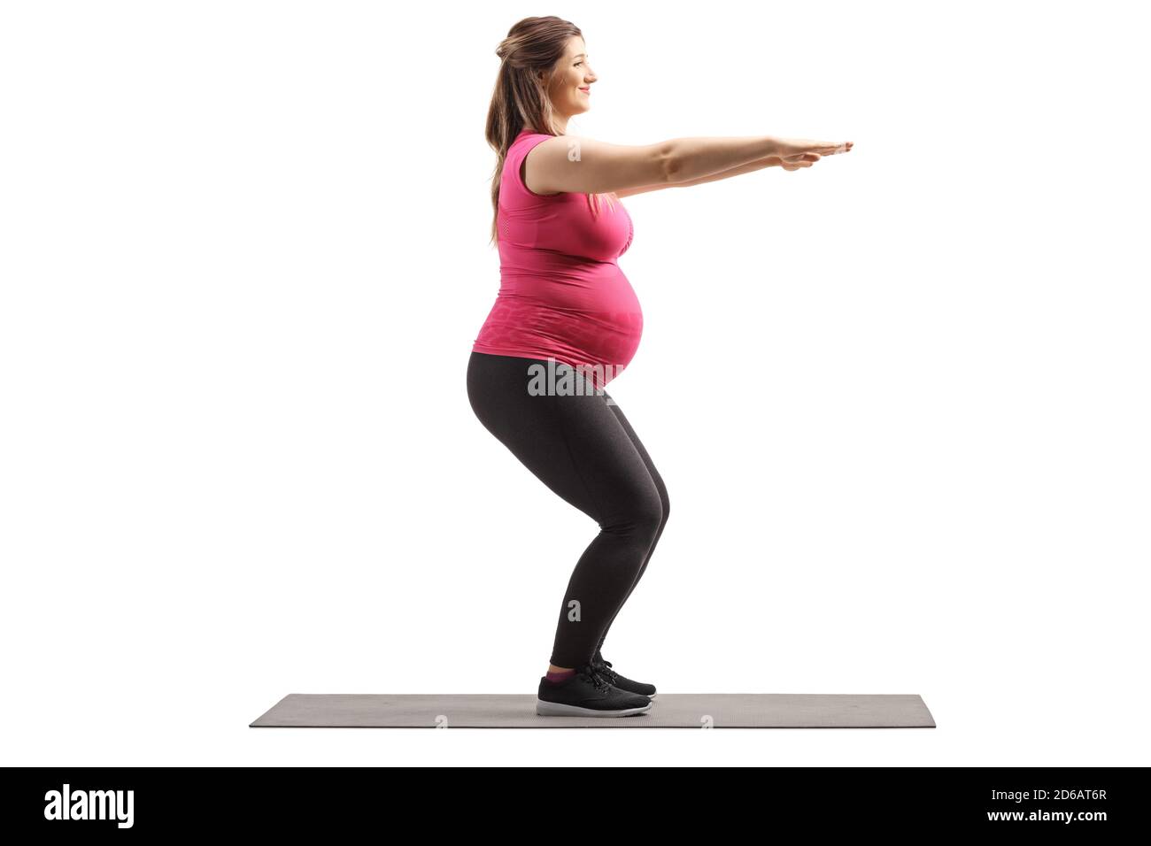 In voller Länge Profilaufnahme einer schwangeren Frau Ausübung Kniebeugen Isoliert auf weißem Hintergrund Stockfoto