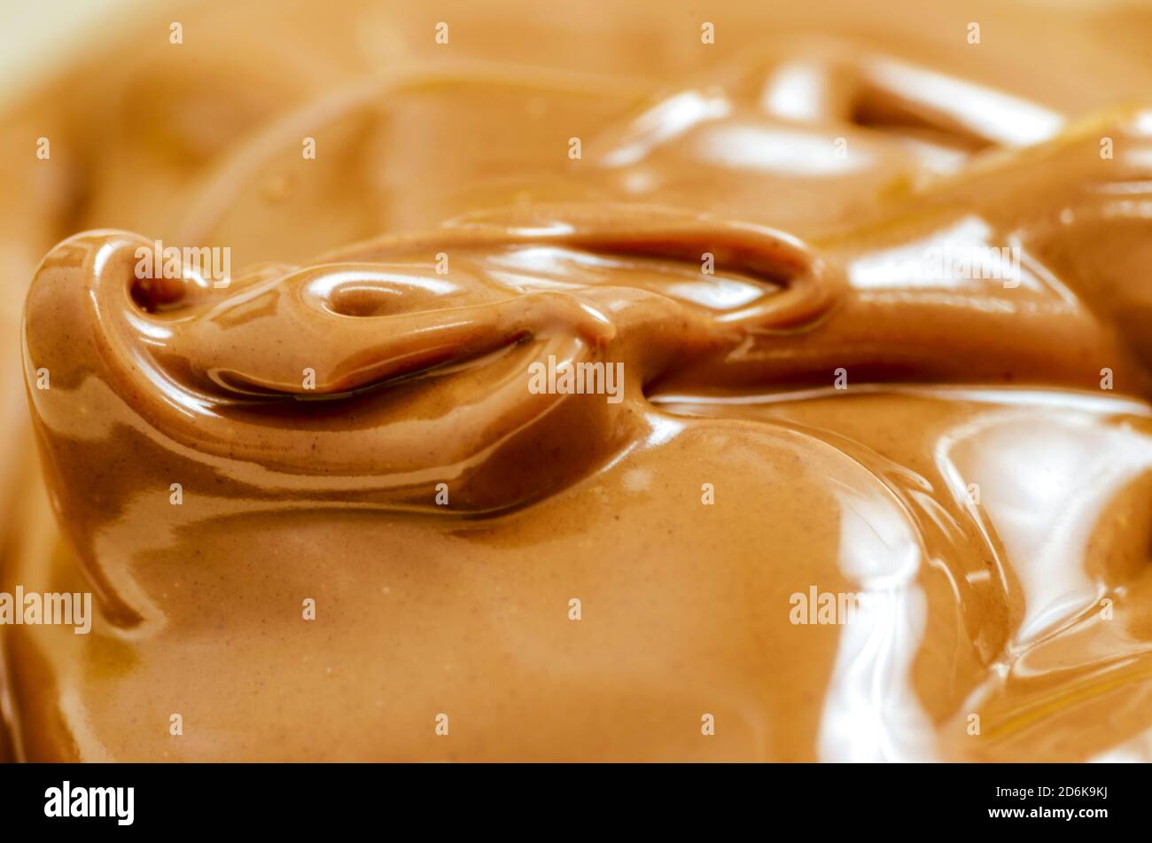 Makro-Aufnahme von köstlichen Schokolade Aufstrich Hintergrund Stockfoto