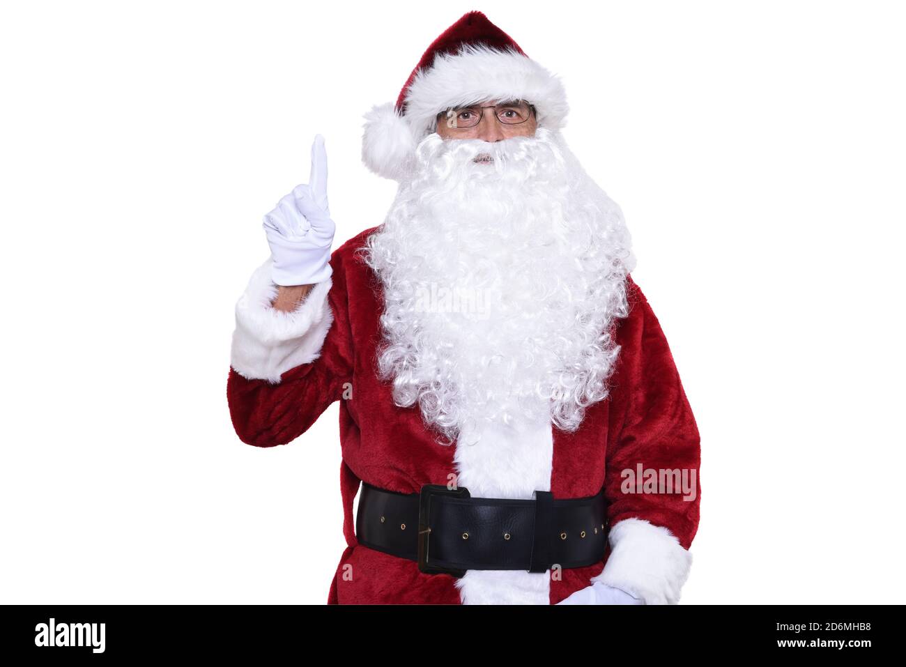 Älterer Mann in traditioneller Weihnachtsmann-Tracht mit einem Finger nach oben. Das Konzept der Nummer eins. Stockfoto