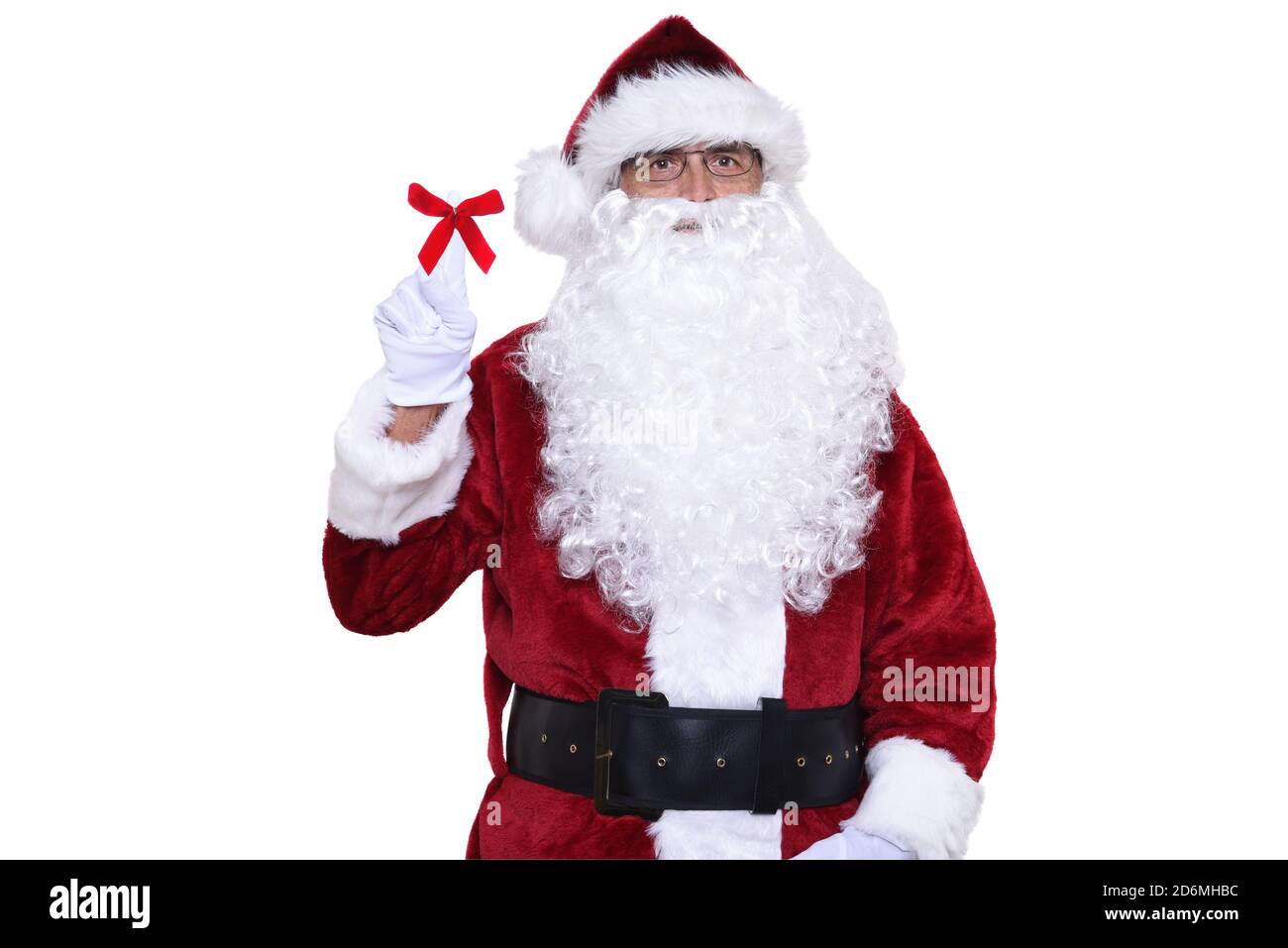 Älterer Mann in traditioneller Weihnachtsmann-Tracht mit einem Finger nach oben. Das Konzept der Nummer eins. Stockfoto