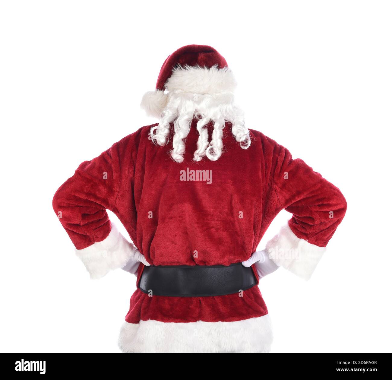 Weihnachtsmann von hinten gesehen stehend Akimbo mit geschlossenen Fäusten auf Hüften. Isoliert auf Weiß. Stockfoto