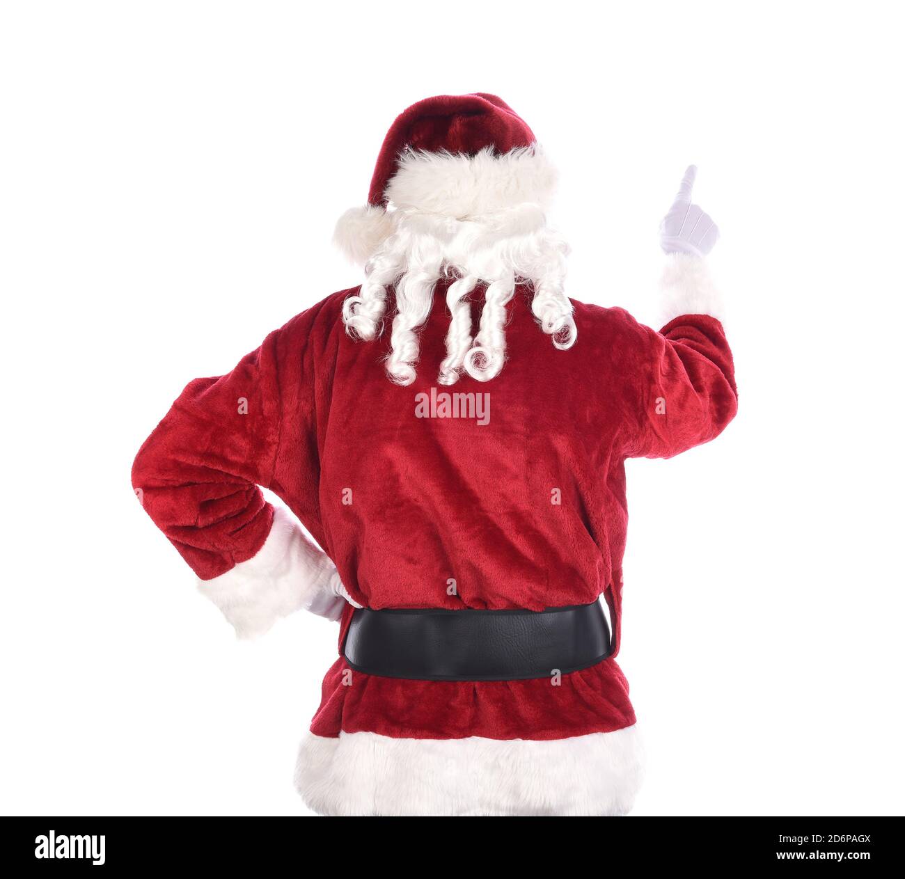Der Weihnachtsmann von hinten mit der einen Hand und der anderen auf der Hüfte. Isoliert auf Weiß. Stockfoto