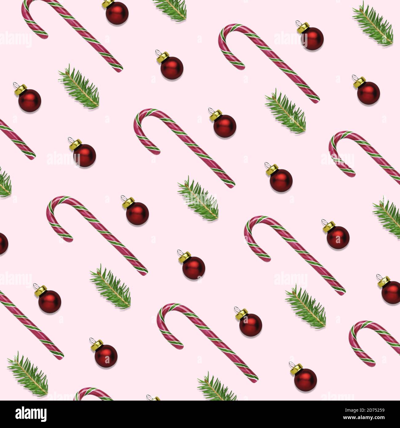 3D-Illustration von weihnachten oder Neujahr rosa Hintergrund mit Zuckerrohrstäbchen, roten Kugeln und Tannenzweigen. Geschenkpapier-Konzept für den Winter Stockfoto