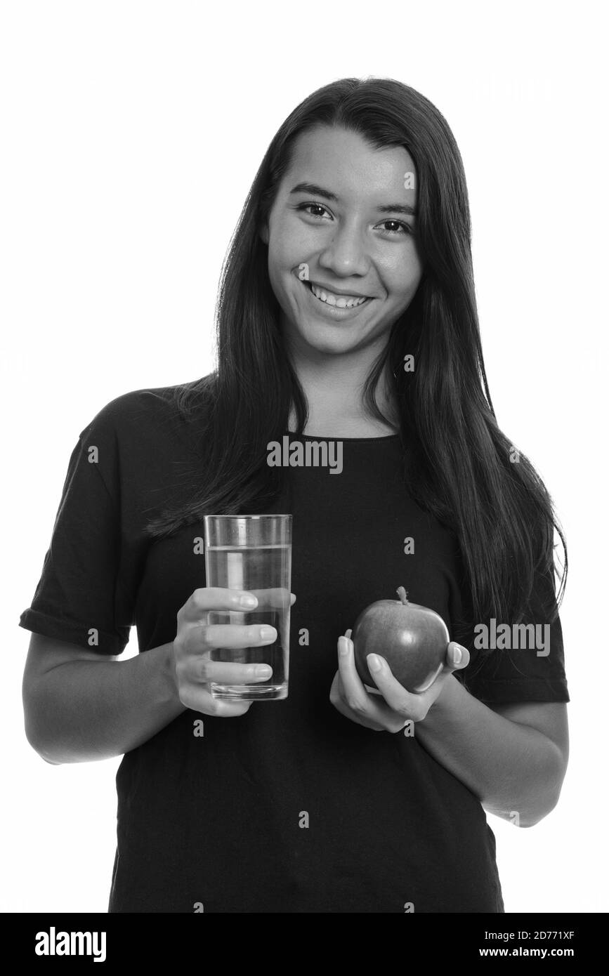 Portrait von glücklichen jungen schönen Frau hält Apfel und Glas Von Wasser Stockfoto