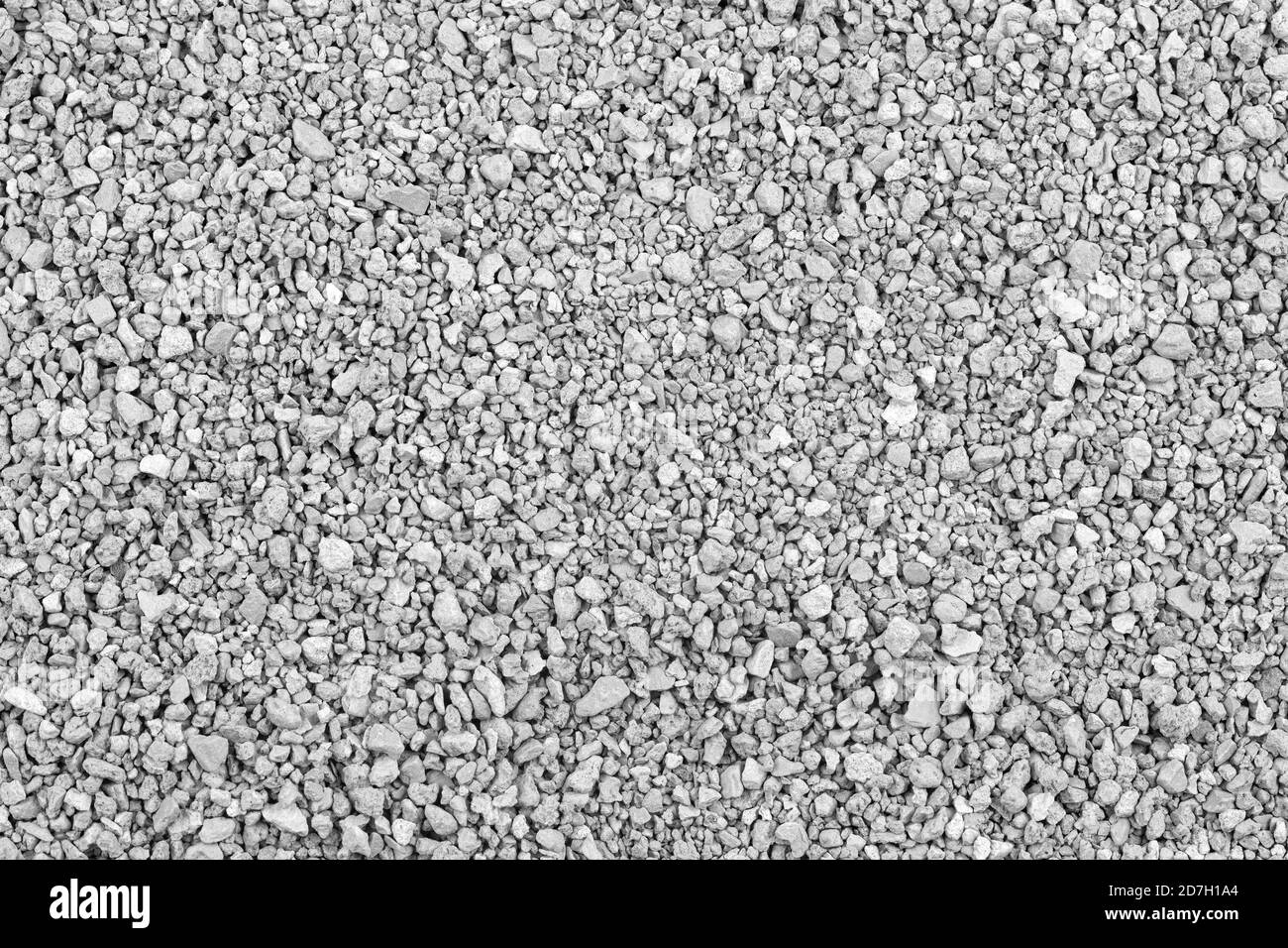 Grau kleine Felsen Boden Textur. Schwarz kleine Straße Stein Hintergrund. Kies Kieselsteine Stein nahtlose Textur. Dunkler Hintergrund von zerkleinerten Granit Kies, Stockfoto