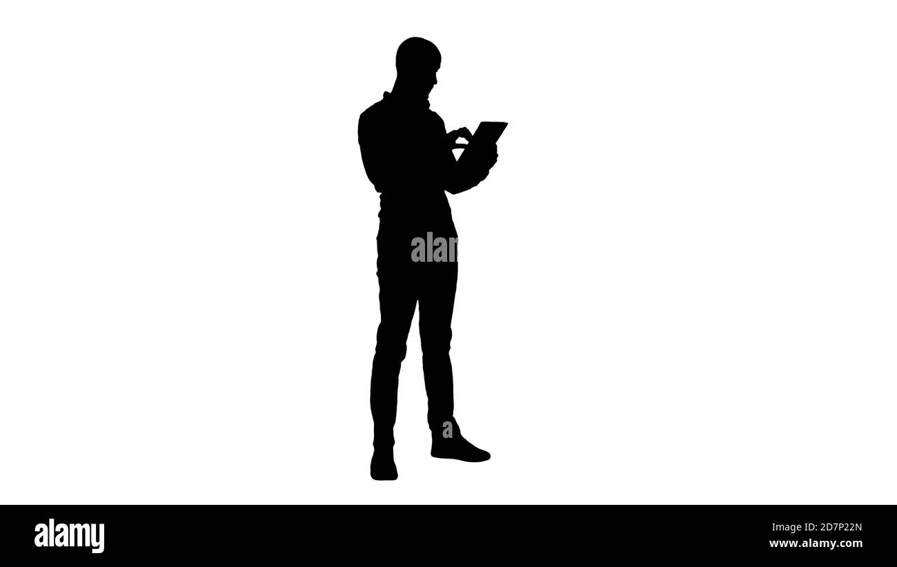 Silhouette schöner arabischer Geschäftsmann mit Tablet. Stockfoto