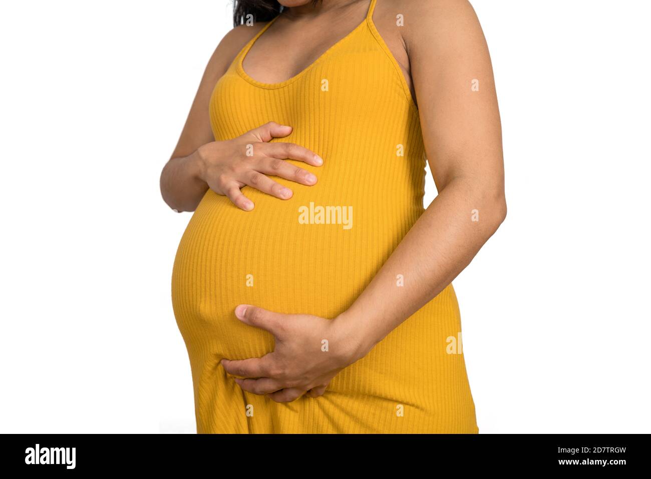 Nahaufnahme der schwangeren Frau, die ihren großen Bauch berührt. Schwangerschafts-, Mutterschafts- und Erwartungskonzept. Stockfoto