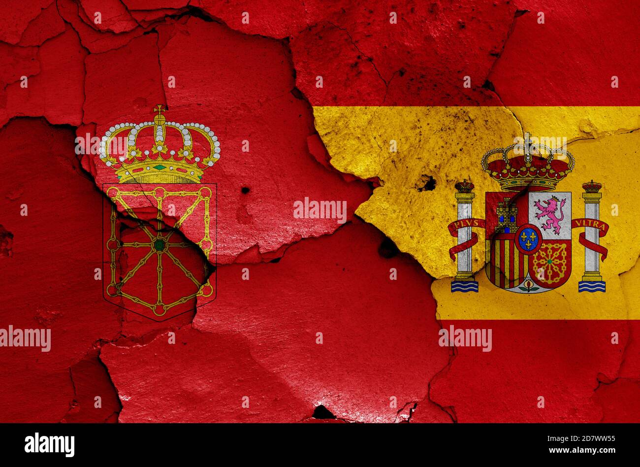 Flaggen von Navarra und Spanien auf rissige Wand gemalt Stockfoto