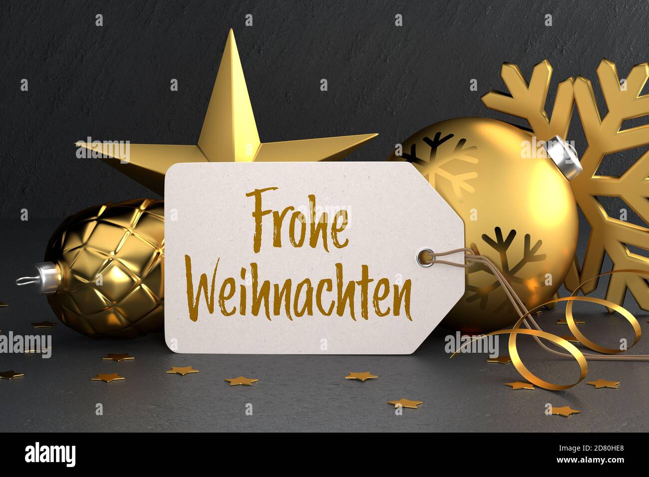 Weihnachten - Geschenkanhänger mit der deutschen Botschaft 'Frohe Weihnachten' (Frohe Weihnachten) Auf einem schwarzen Stein Hintergrund lehnt sich gegen Gold farbigen weihnachten Stockfoto