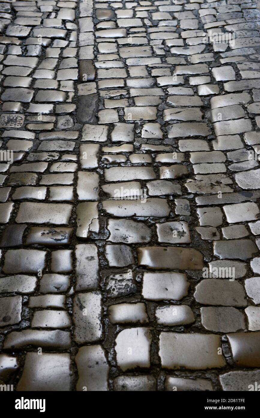 Alte Pflastersteinpflaster Nahaufnahme, abstrakter Hintergrund. Stockfoto