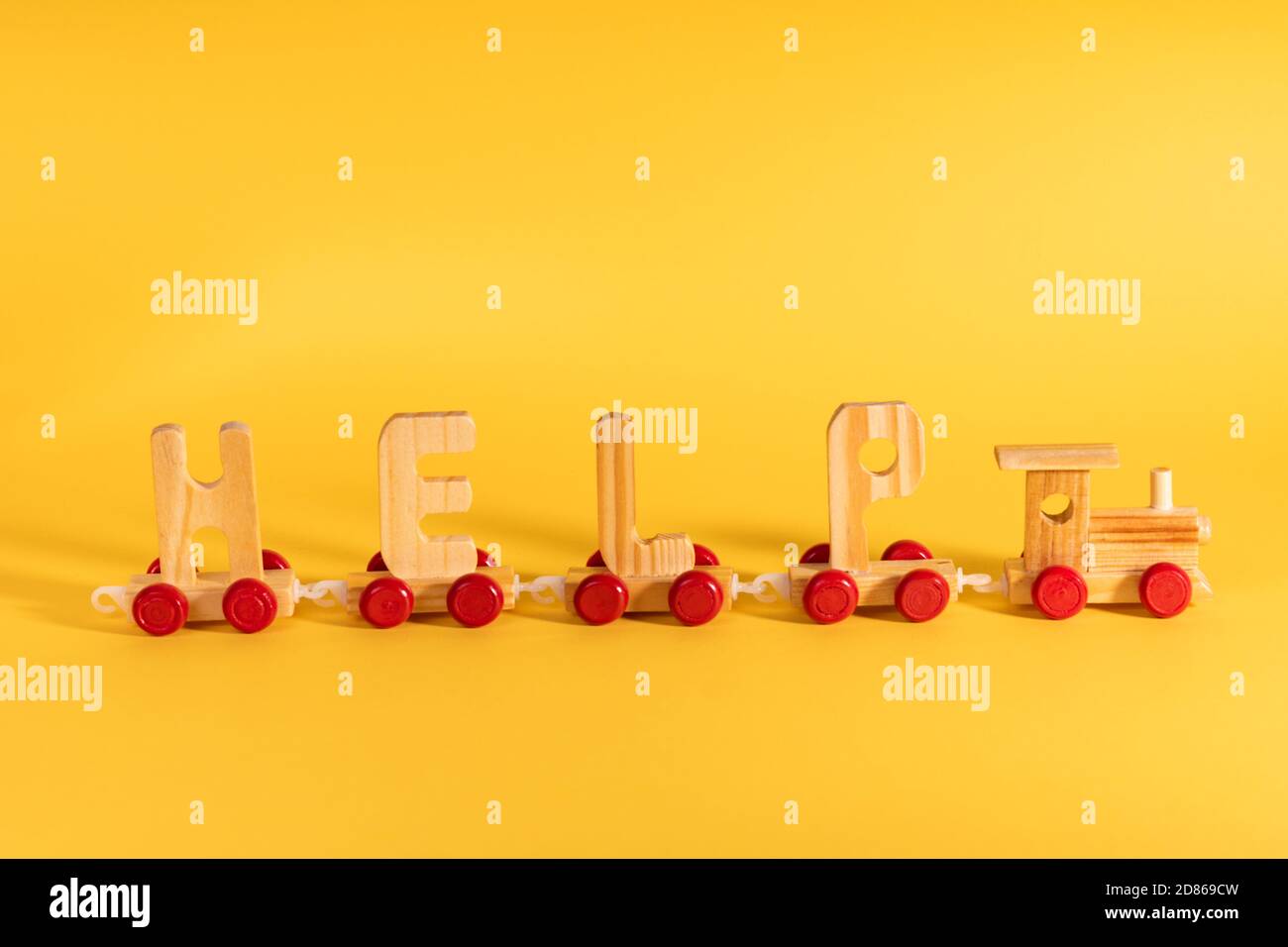 Humanitarian aid, material assistance, governmental help concept. Train with letters HELP during COVID-19 Stockfoto