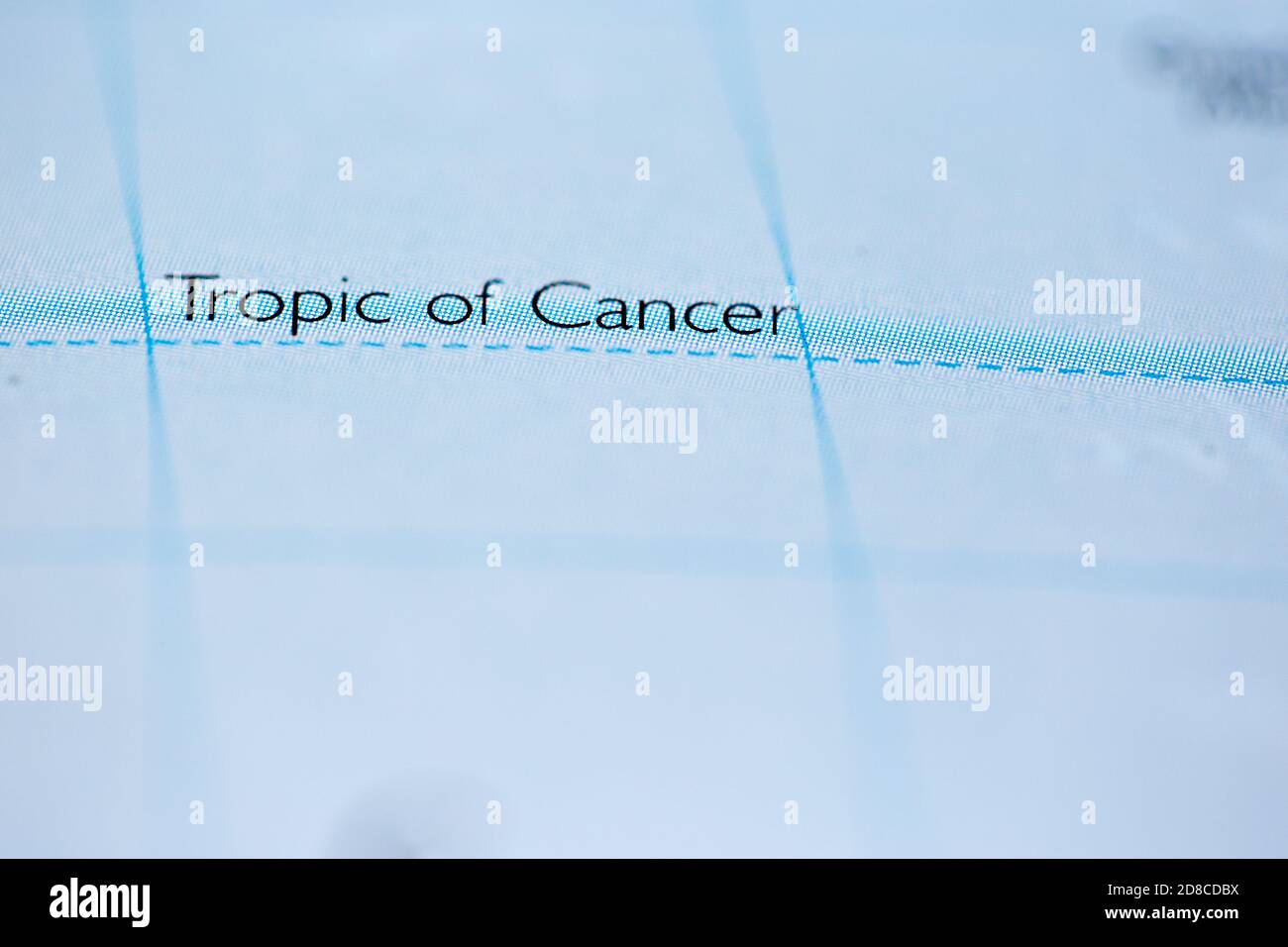 Geringe Schärfentiefe Fokus auf geografische Kartenposition von Tropic of Cancer Linie auf Atlas Stockfoto