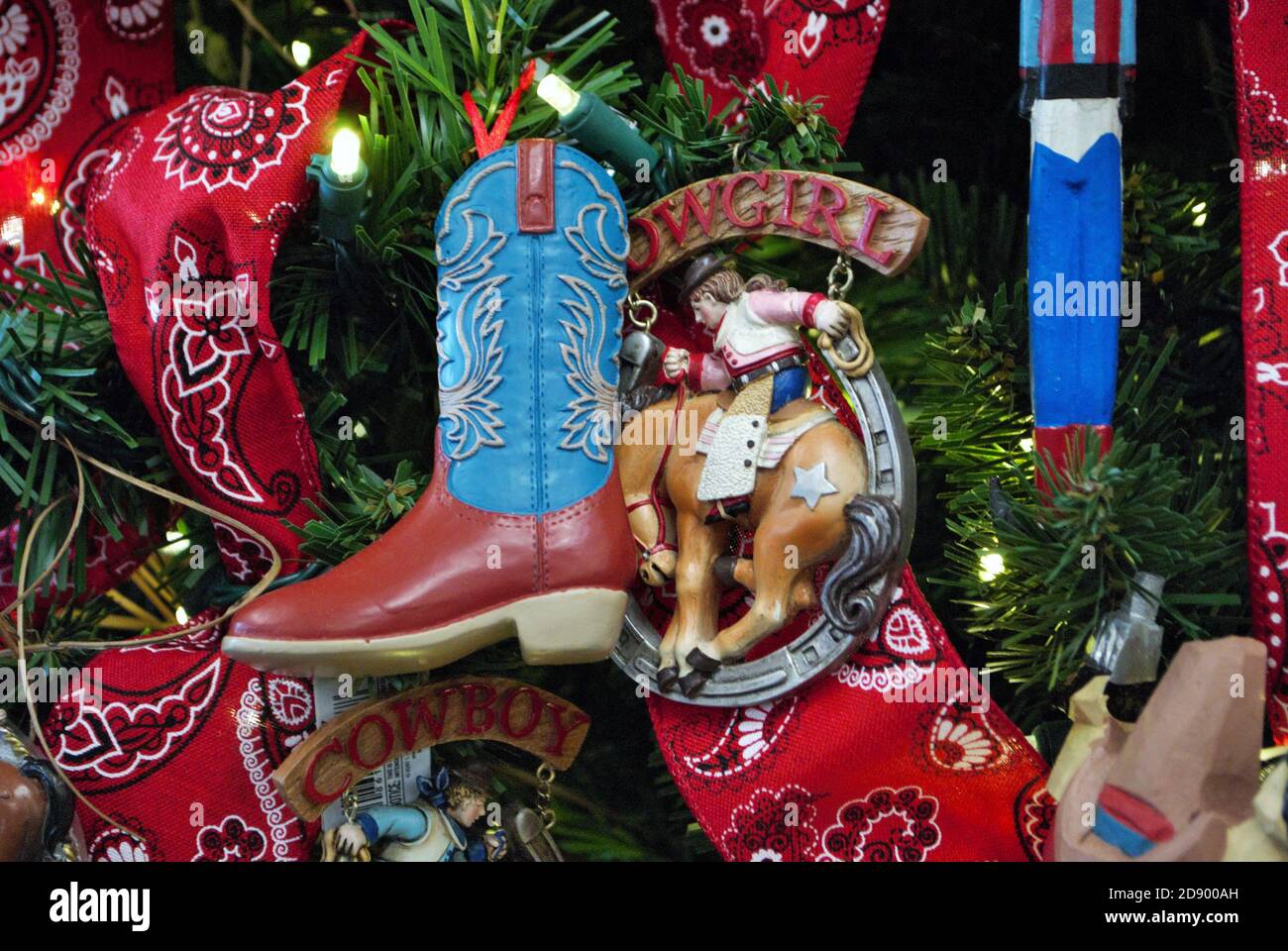 Weihnachtsbaum Szene Hintergrund mit Cowboy-Thema und Lichter Stockfoto