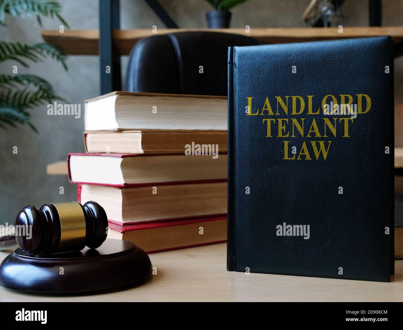 Vermieter Mieter Gesetz Buch auf dem Anwalt Schreibtisch. Stockfoto