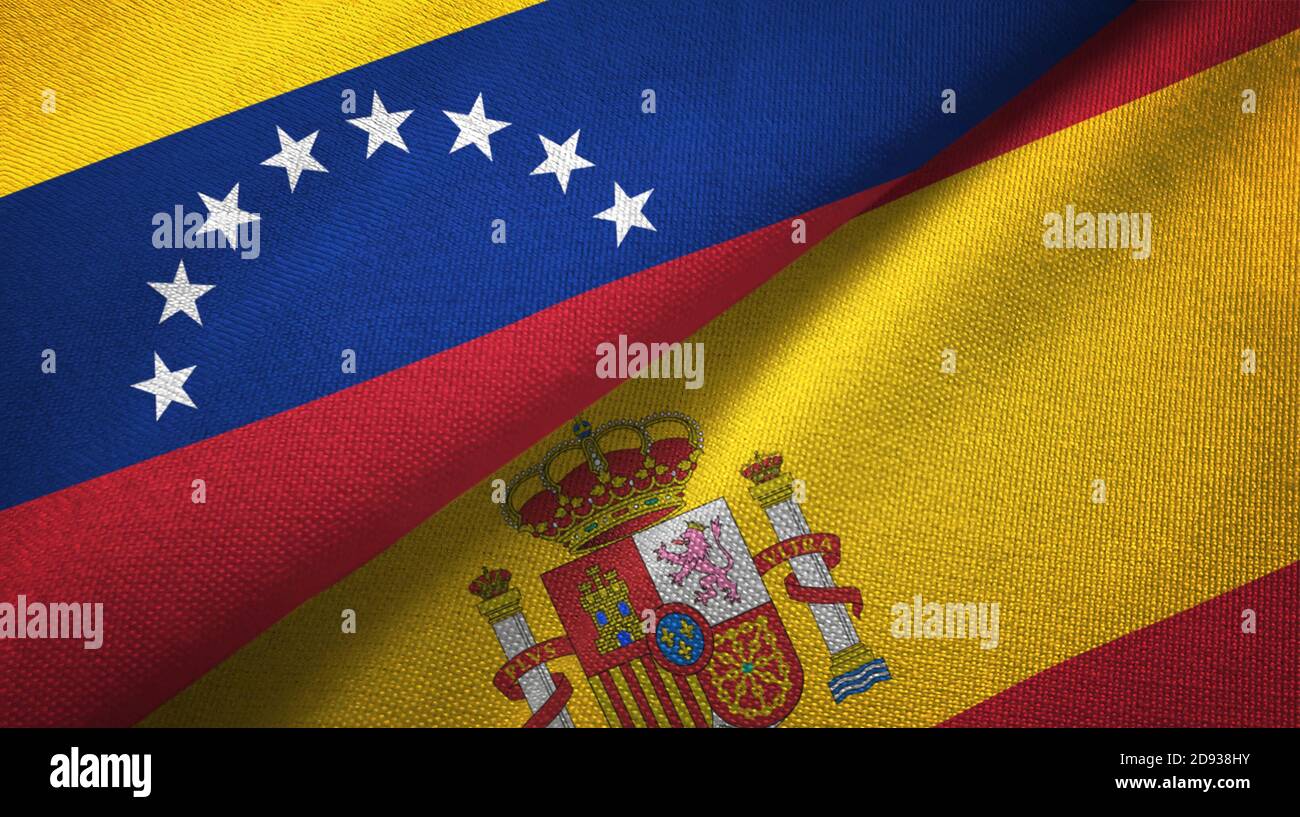 Venezuela und Spanien zwei Flaggen Textiltuch, Stoff Textur Stockfoto