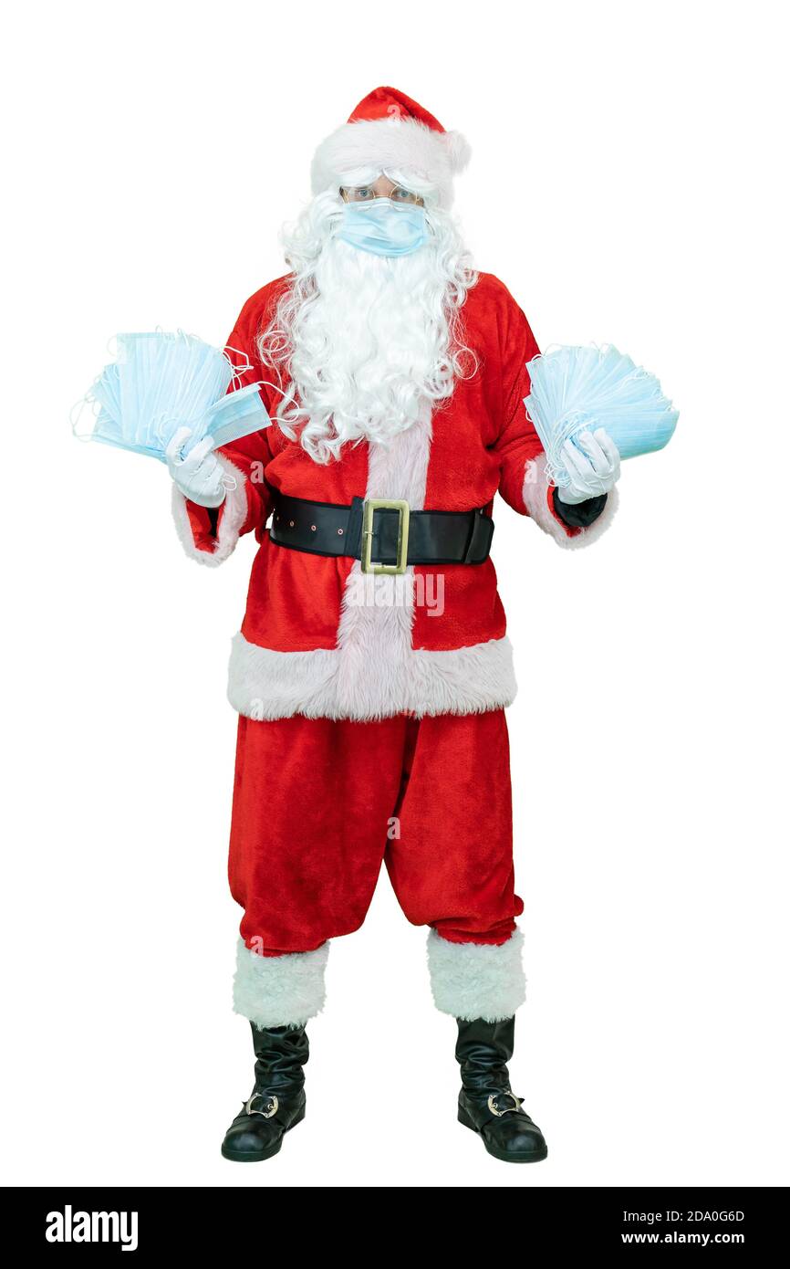 Santa Claus in einer covid medizinische Maske, hält Maske oder Atemschutzmasken Epidemie oder Coronavirus Schutz Stockfoto