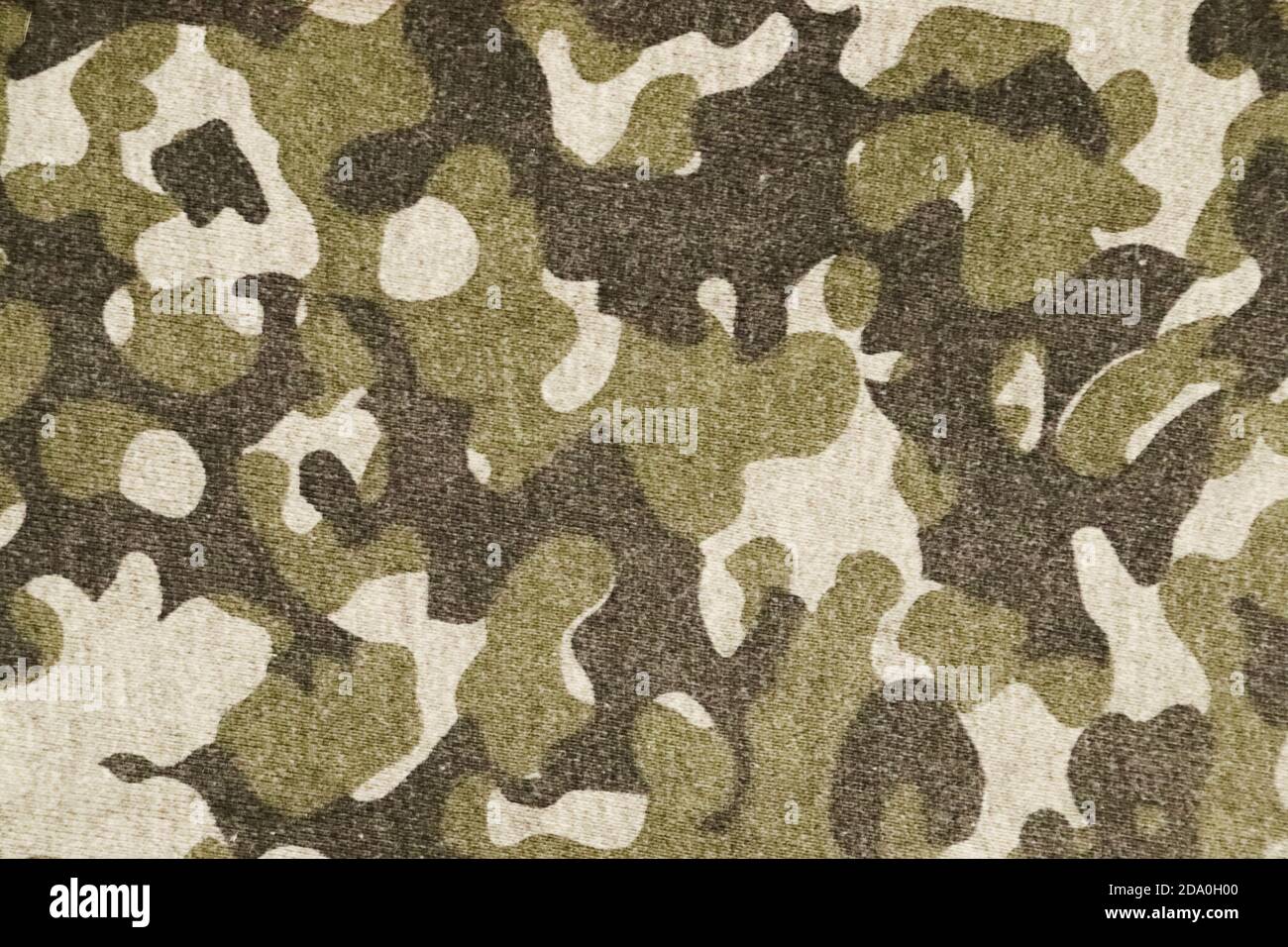 Vintage militärischen Hintergrund. Stoff mit grünem Retro-Camouflage-Muster. Stockfoto