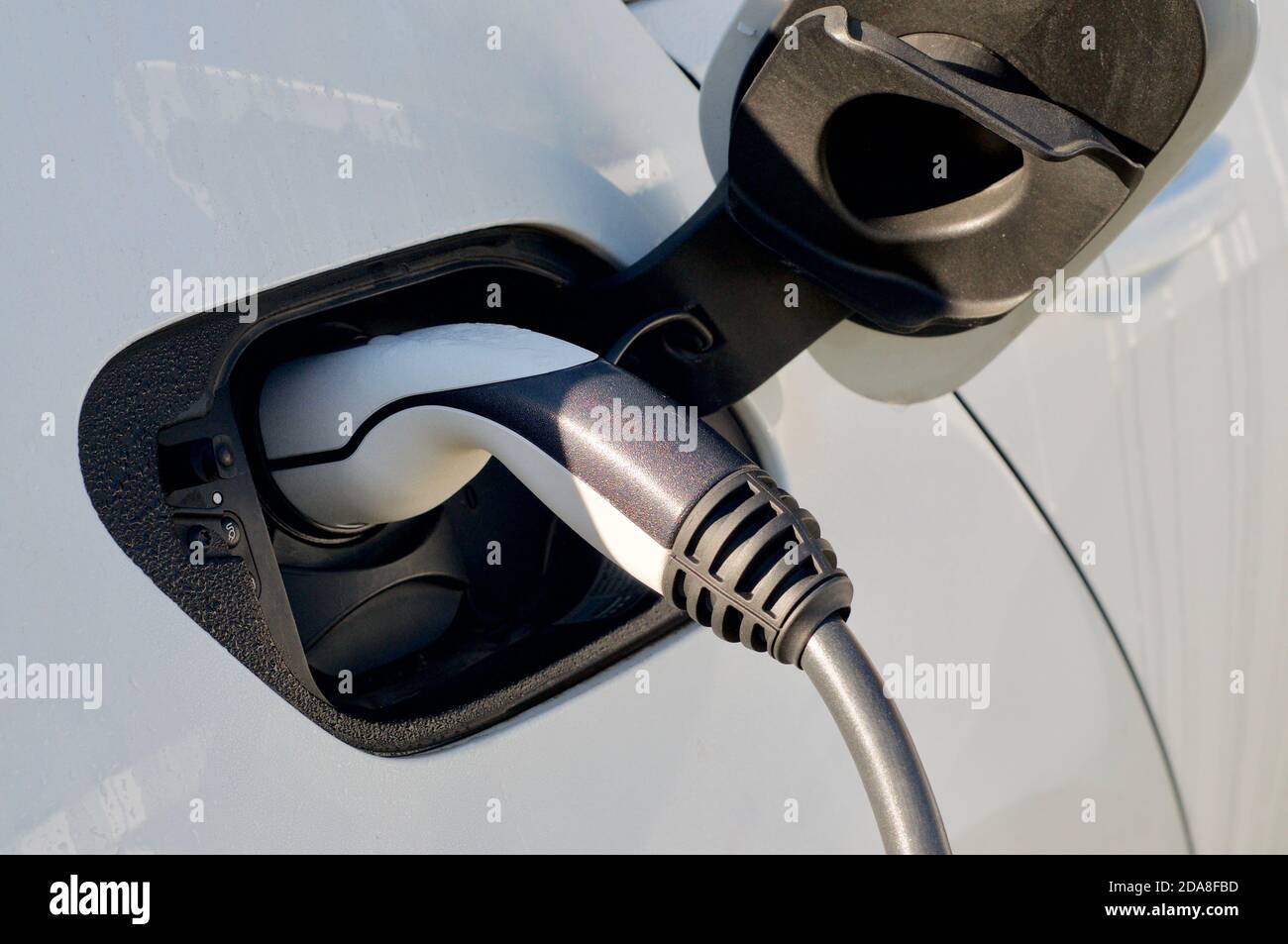 EV Auto oder Elektroauto an der Ladestation mit dem Stromversorgung Stockfoto