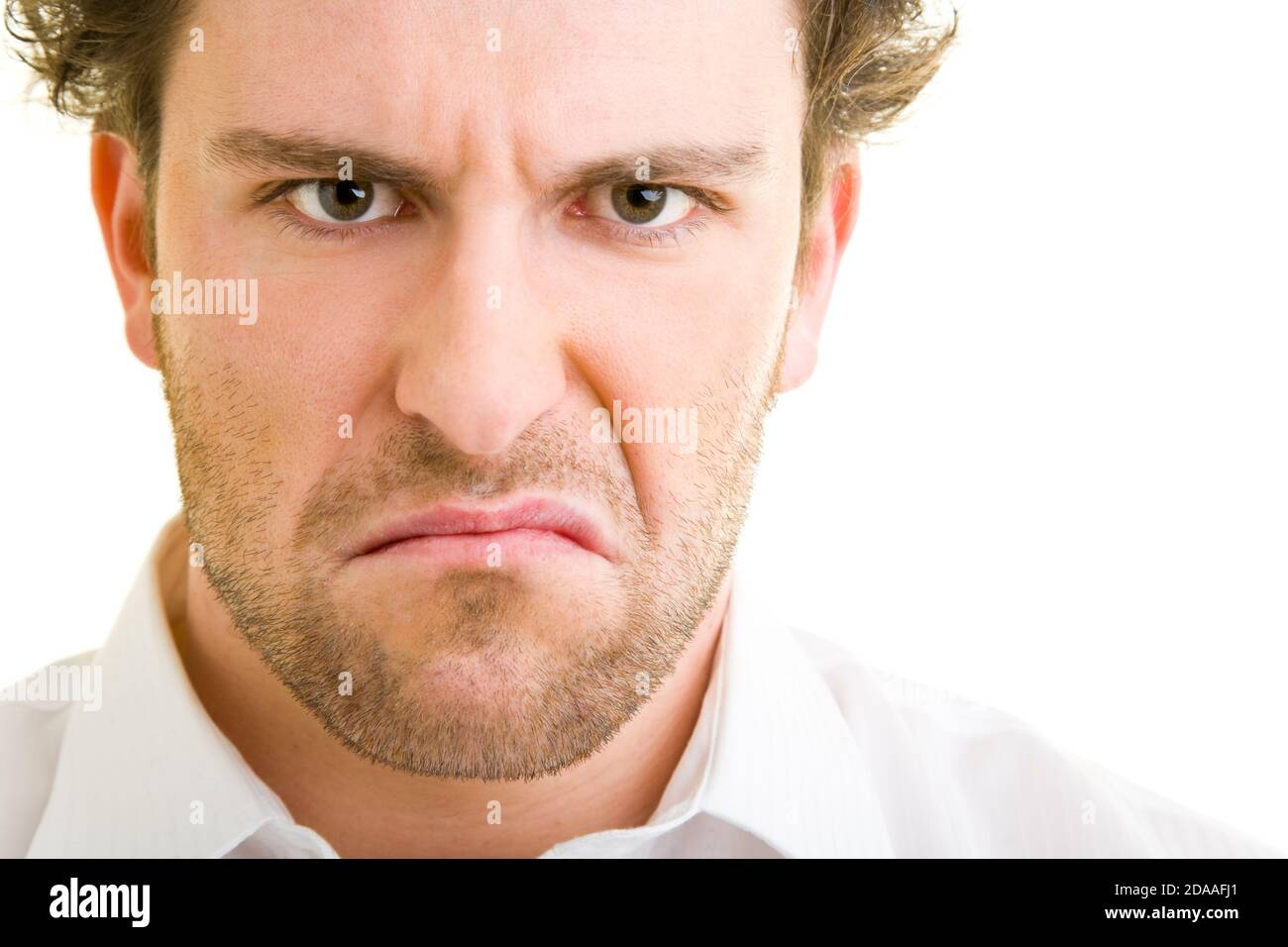 Der junge Mann sieht frustriert aus Stockfoto