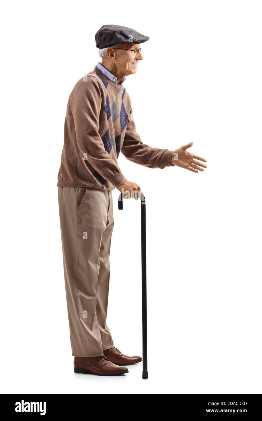 In voller Länge Profilaufnahme eines älteren Mannes mit einem Gehstock Begrüßung mit Hand isoliert auf weißem Hintergrund Stockfoto