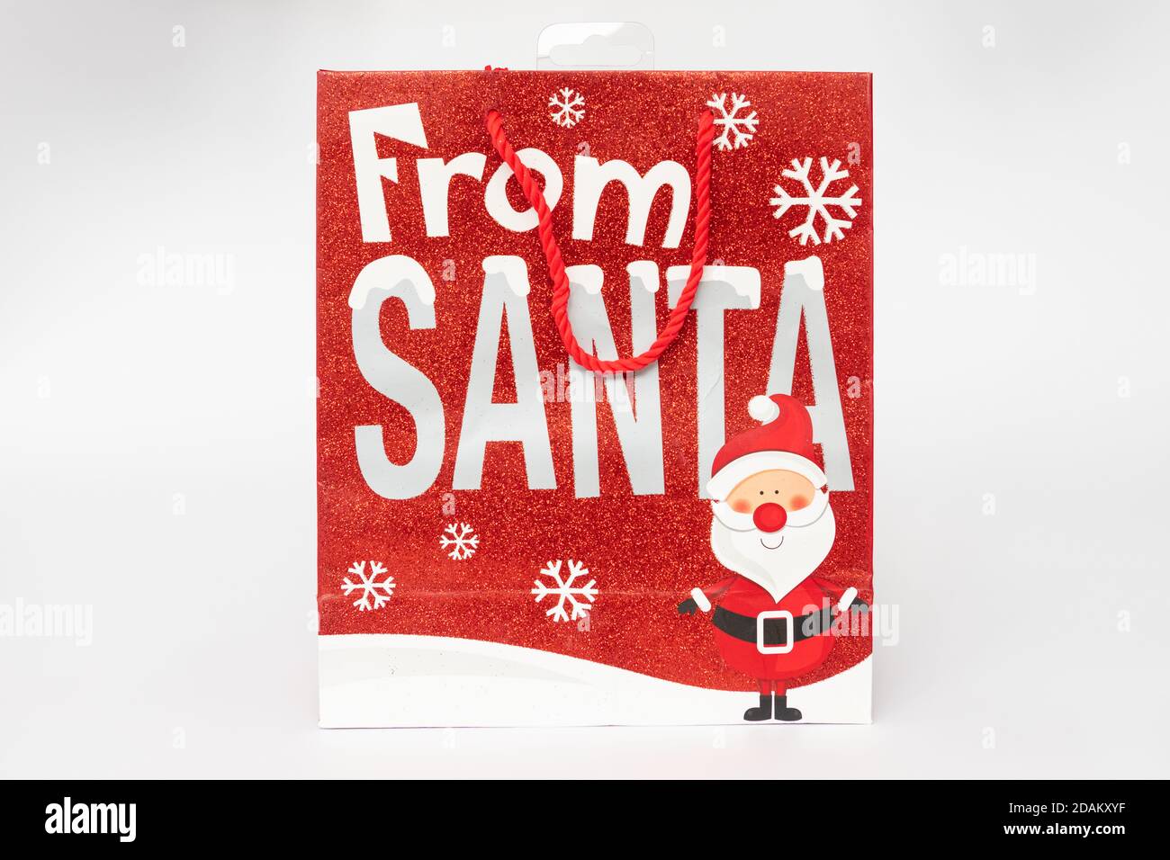 weihnachts-Geschenktasche mit Glitzer bedeckt Stockfoto