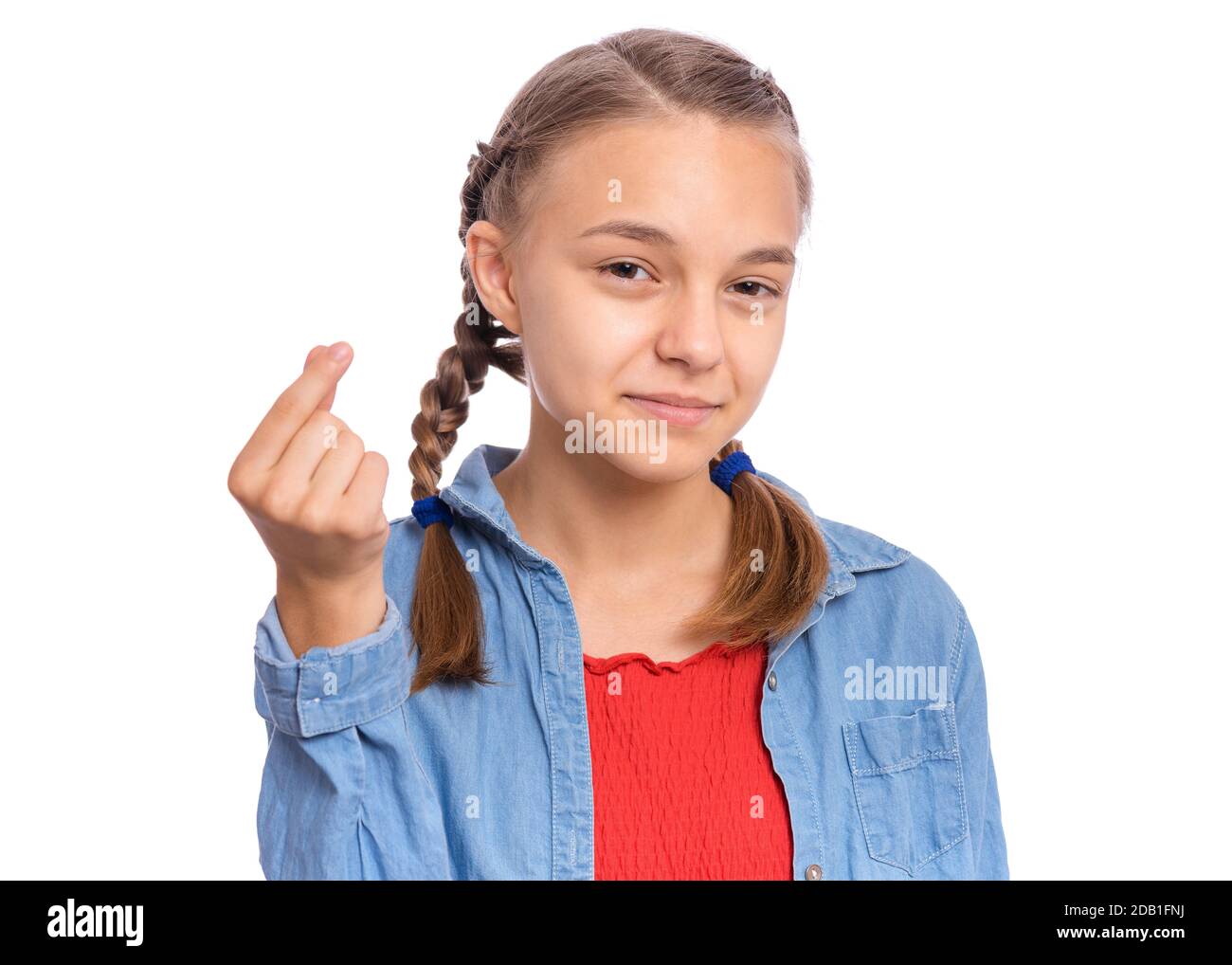 Happy Teenager-Mädchen zeigt Zeichen Symbol des Geldes durch Finger, isoliert auf weißem Hintergrund Stockfoto